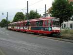 Eine Doppeltraktion aus Stadtbahnwagen B ist am 11.06.2004 am Rheinbahnhaus in Dsseldorf-Oberkasseler unterwegs.