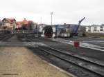 In der Einsatzstelle Wernigerode dampft 99 7241-5 am 14.12.2015 kr�ftig vor sich hin und wird von ihrem Personal gehegt und gepflegt.